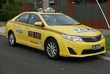 Yellow Toyota taxi