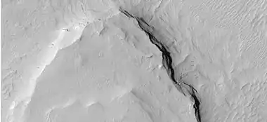 Close-up of layers on edge of a mesa in Gill crater, as seen by HiRISE under HiWish program