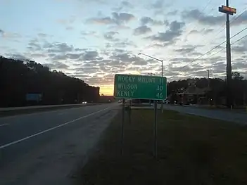 Southbound NC&nbsp;4 near Rocky Mount, where the destination sign still shows Wilson and Kenly.