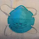A 3M 1860 filtering facepiece respirator with fluid resistance