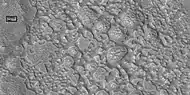 Surface breaking down, as ice is removed, as seen by HiRISE under HiWish program. Box shows size of football field.