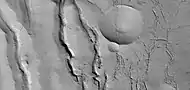 Close view of cracks of various sizes, as seen by HiRISE under HiWish program.  Ice disappears along crack surfaces and makes crack larger.