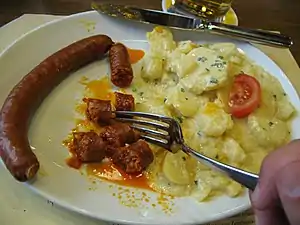 Swiss cuisine – paprika sausage with potatoes at the Zeughauskeller, Zürich, Switzerland