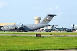 A C-17A Globemaster III of the 911th Airlift Wing about to exit the runway with its sister ships on the flight-line at Pittsburgh International Airport ARS