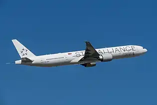 Singapore Airlines Boeing 777-300ER in Star Alliance livery with white tail.