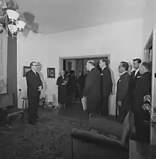 Photograph of a delegation (including L. A. Puntila&nbsp;[fi]) visiting professor A. I. Virtanen on his 70th birthday in 1965