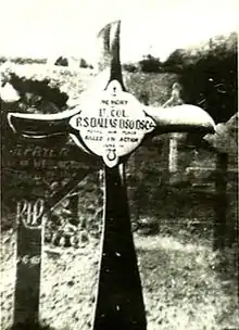 Crucifix, made from an aeroplane propeller, in a cemetery. The inscription reads "Lt. Col. R.S. Dallas DSO DSC ... Killed in Action"