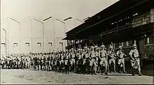 A group of soldiers marching in column of route