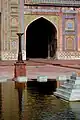 The courtyard ablution pool features a small fountain.