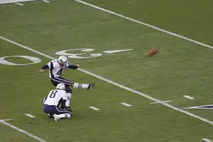 Vinatieri kicking on the field