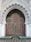 The wooden anaza at the courtyard entrance to the prayer hall