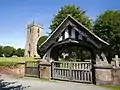 Lychgate and west tower ofAll Saints' parish church.