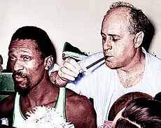 Auerbach leaning against Russell