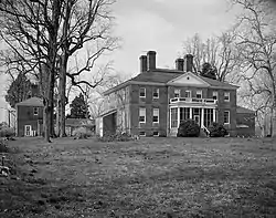 Large, two-storey home with four brick chimneys