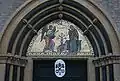 Detail of the main entrance with the coat of arms of the Holy See