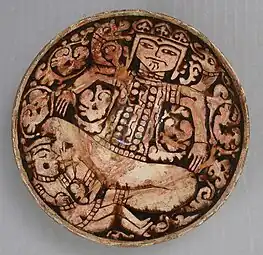 12th–13th century bowl depicting King Zahhak with snakes protruding from his shoulders, likely from Northwestern Iran. Modified c. 1926, as many medieval pieces were to make them more attractive.