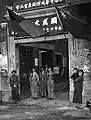 Boy Scouts standing in front the door of a polling office in Shanghai