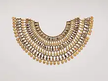 Necklace of rows of gold beads