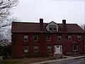 Butler Block, commercial and residential, 1800s building; part of the building houses the Linwood Post Office within the town limits of Uxbridge.