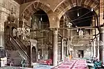 Prayer hall of the mosque, with minbar visible (left)
