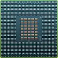 The underside of the 90&nbsp;nm Cell/B.E. processor showing its 1242 solder balls, each 0.6&nbsp;mm in diameter, and its array of 35 capacitors