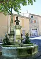 Fountain in Châteauneuf-de-Gadagne, with a bust of native Alphonse Tavan, one of the co-founders of the Félibrige.