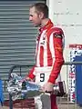 Olympiacos driver Chris van der Drift with his podium trophies at Silverstone (2010)
