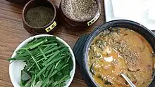 loach soup served with Zanthoxylum piperitum and perilla seed powder