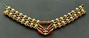Necklace with gold beads and carnelian beads, Cypriot artwork with Mycenaean inspiration, c. 1400–1200 BC.[citation needed] From Enkomi. British Museum.