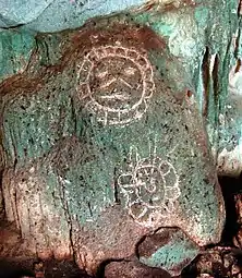 Carvings on rock in Cueva Lucero