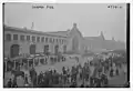 People waiting for the ocean liner RMS&nbsp;Mauretania&nbsp;(1906) at the Cunard Pier in New York City which was returning with American aviators and other troops from Europe after World War I on December 2, 1918