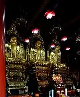 Amitābha (left), The Buddha (center), and Bhaisajyaguru (right)