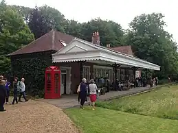 Two railway platforms with the space between them filled in and planted as a lawn