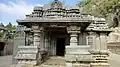 Porch entrance to Akkana Basad with the awning supported by half pillars with old Kannada inscription on the side.