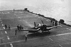 An F4U-1 Corsair making the 5,000th landing aboard Takanis Bay
