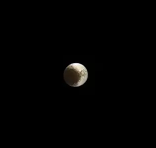 One of Cassini's final images of Iapetus taken on May 30, 2017, a few months before Cassini plunge into Saturn, at a distance of 2.5 million kilometers (1.5 million miles). The clearly-visible  craters right of center on the white side are Naimon, Astor and Ivon (left to right).