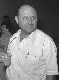 Hartuv with a glass in hand.
