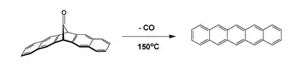 Formation of pentacene by extrusion of carbon monoxide