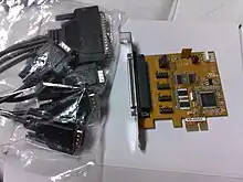 A four-port serial (RS-232) PCI Express&nbsp;×1 expansion card with an octopus cable that breaks the card's DC-37 connector into four standard DE-9 connectors