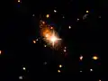 Arc-shaped tidal tails in galaxy 3C186.