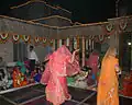 Women performing ghoomar at wedding