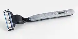 A Gillette Mach3 razor handle with a blade cartridge attached