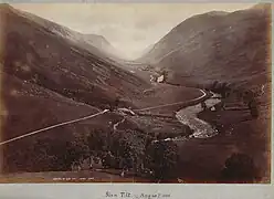 Wilson's August 1885 photograph of the Glen Tilt looking upstream toward Forest Lodge.    Location: 56°49′29″N 3°47′38″W﻿ / ﻿56.82461°N 3.79392°W﻿ / 56.82461; -3.79392﻿ (Glen Tilt June 2019)