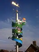 Wind vane in the centre of town displaying the legends of Gotham