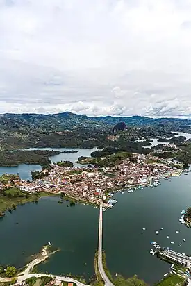Aerial image of Guatapé and in the background the Piedra del Peñol