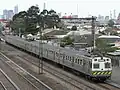 Hitachi in green and gold The Met livery near Middle Footscray in September 2006