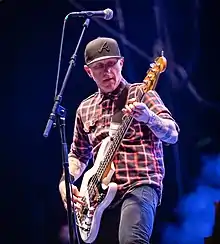 A man playing a bass guitar