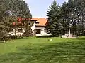 Municipal office and a small park with bust of Josef Lada