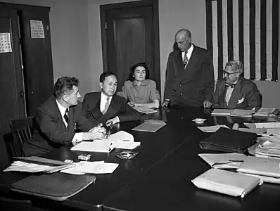 Qian at his deportation hearing, 1950. Others, from left, are Grant B. Cooper, Xuesen's attorney; a hearing reporter, Albert Del Guercio, examining officer, and Ray Waddell, hearing officer.