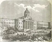 Front of an imposing Georgian-style building with columned portico at the entrance